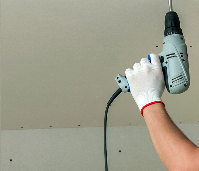 Person working with drywall